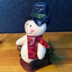 Plush Snowman on Sled, polyester fiber filled.